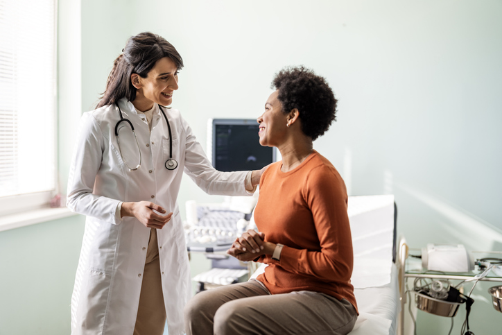 female physician with female patient 